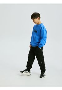 Reserved - Spodnie cargo - czarny. Kolor: czarny. Materiał: bawełna, dzianina