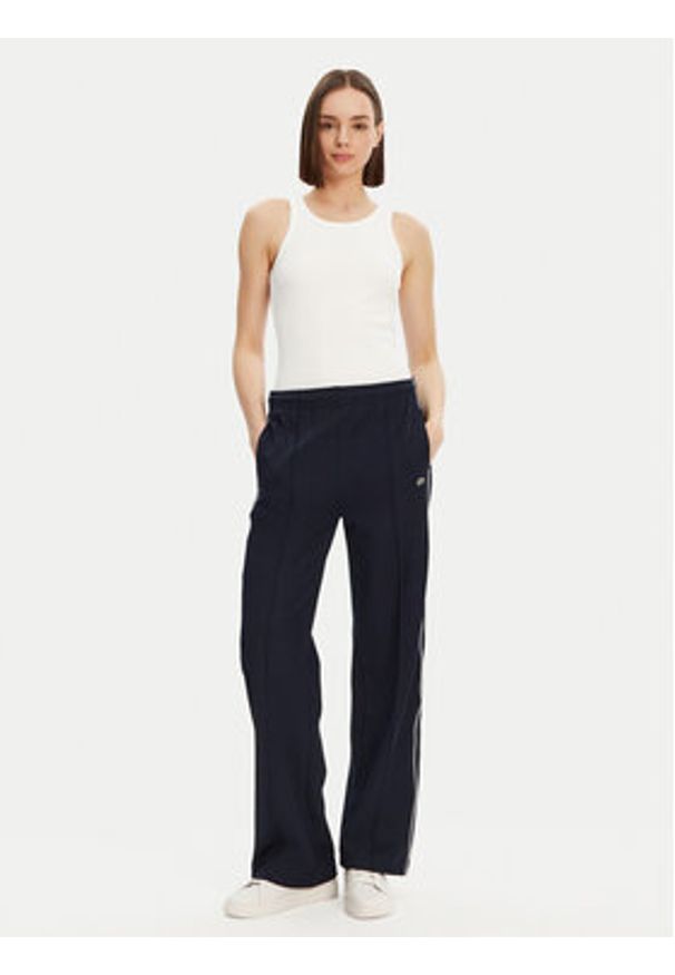 Lacoste Spodnie dresowe XF7260 Granatowy Relaxed Fit. Kolor: niebieski. Materiał: bawełna