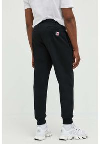 Karl Kani spodnie dresowe kolor czarny z aplikacją 6004039-black. Kolor: czarny. Materiał: dresówka. Wzór: aplikacja #5