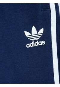 Adidas - adidas Spodnie dresowe 3-Stripes HK0353 Granatowy Standard Fit. Kolor: niebieski. Materiał: bawełna