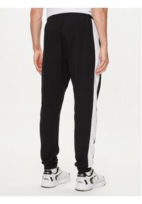 Fila Spodnie dresowe FAM0612 Czarny Regular Fit. Kolor: czarny. Materiał: bawełna #5