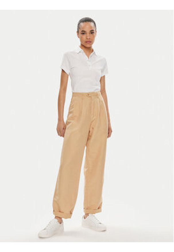 TOMMY HILFIGER - Tommy Hilfiger Spodnie materiałowe WW0WW41355 Beżowy Relaxed Fit. Kolor: beżowy. Materiał: bawełna