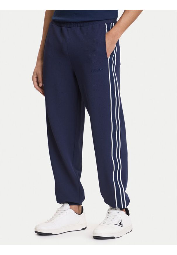 Guess Spodnie dresowe Z6GB11 K3202 Granatowy Regular Fit. Kolor: niebieski. Materiał: syntetyk