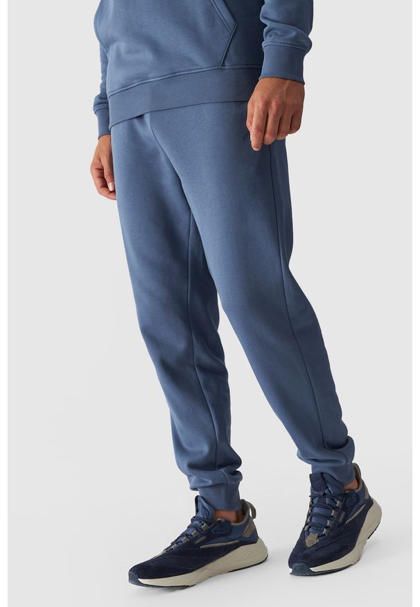 4f - 4F Spodnie dresowe joggery męskie - niebieskie 3XL. Kolor: niebieski. Materiał: dresówka. Wzór: gładki, ze splotem