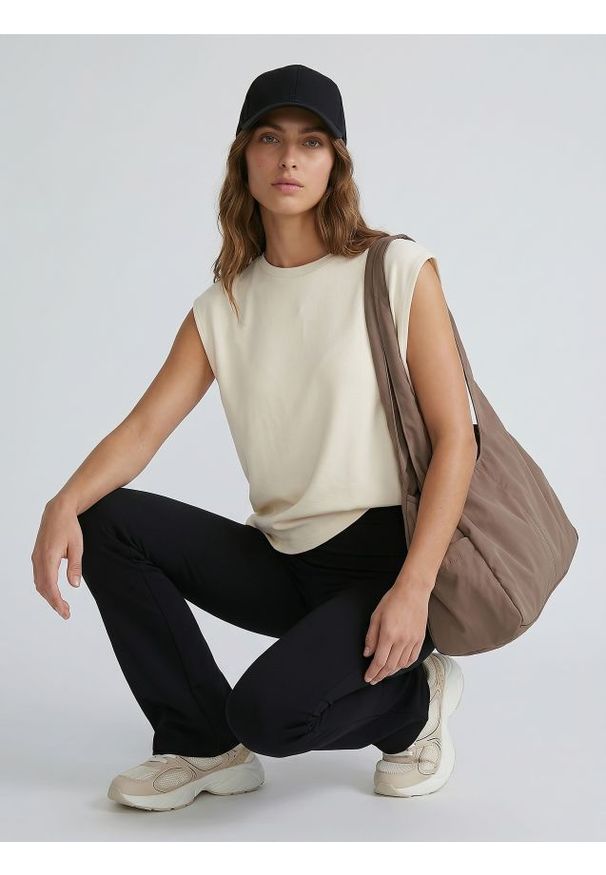 Sinsay - Legginsy flare z dzianiny technicznej - czarny. Kolor: czarny. Materiał: dzianina
