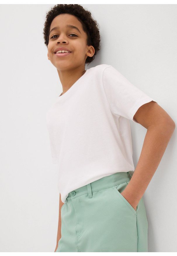 bonprix - Spodnie garniturowe Slim Fit. Kolor: zielony