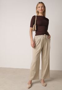 Born2be - Beżowe Szerokie Spodnie z Bawełną Wiskozą Gumką w Pasie i Sznurkiem Iridara. Okazja: na co dzień. Stan: podwyższony. Kolor: beżowy. Materiał: wiskoza, bawełna. Styl: casual, elegancki, klasyczny #8