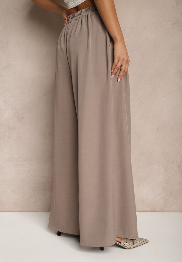 Renee - Jasnobrązowe Eleganckie Spodnie Palazzo z Szerokimi Nogawkami Adivisa. Stan: podwyższony. Kolor: beżowy. Styl: elegancki