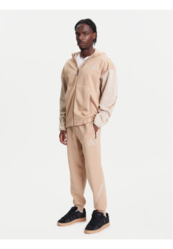 Adidas - adidas Spodnie dresowe Z.N.E. JW4725 Beżowy Loose Fit. Kolor: beżowy. Materiał: bawełna