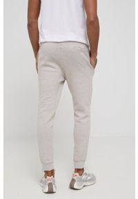 Guess Spodnie męskie kolor beżowy melanżowe. Kolor: beżowy. Materiał: bawełna, materiał, dzianina, włókno. Wzór: melanż #3
