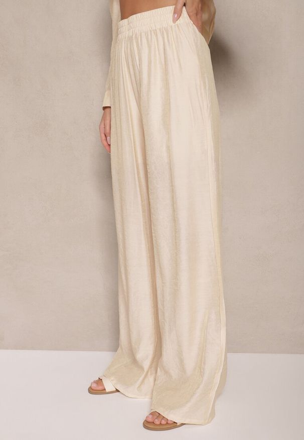 Renee - Jasnobeżowe Spodnie Palazzo High Waist z Szeroką Nogawką i Gumką w Talii Jenarielis. Okazja: na co dzień. Stan: podwyższony. Kolor: beżowy. Styl: casual