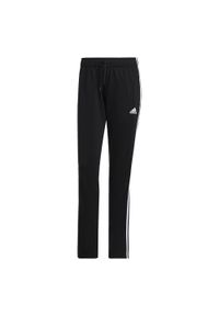 Adidas - Essentials Warm-Up 3-Stripes Track Pants. Kolor: czarny. Materiał: dresówka, materiał. Sport: fitness
