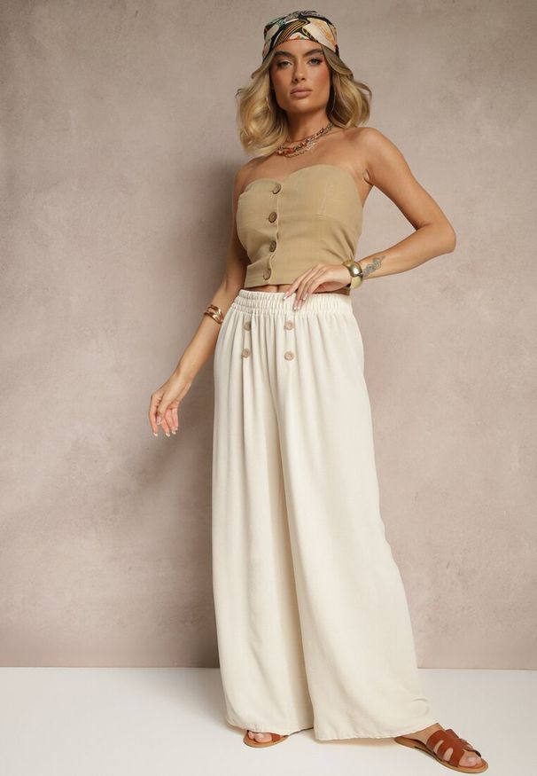 Renee - Jasnobeżowe Spodnie z Bawełną o Szerokim Kroju High Waist Ozdobione Guzikami Morritia. Okazja: na co dzień. Stan: podwyższony. Kolor: beżowy. Materiał: bawełna. Wzór: aplikacja. Styl: casual, elegancki