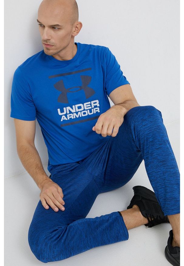 Under Armour - Spodnie. Kolor: niebieski. Materiał: dzianina