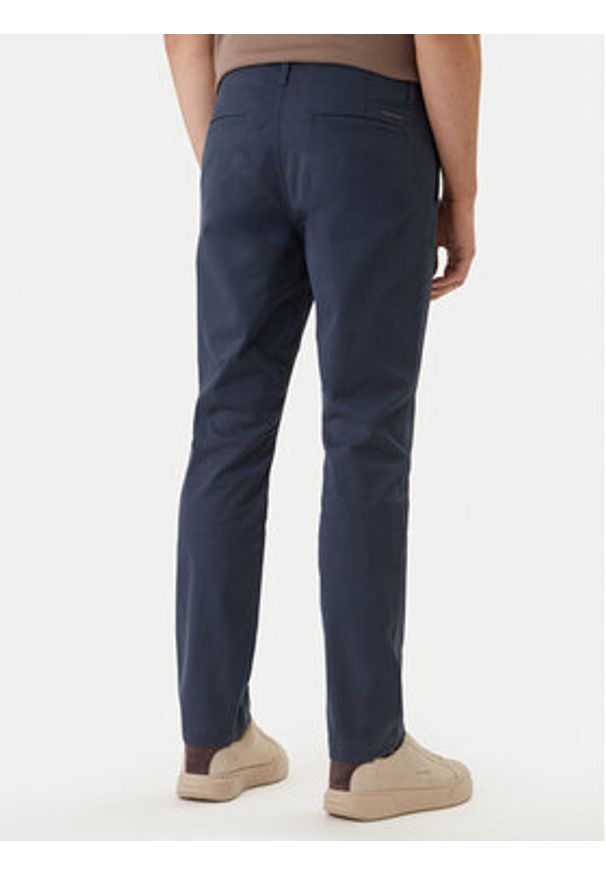 Calvin Klein Jeans Spodnie materiałowe LV04RF618G Granatowy Slim Fit. Kolor: niebieski. Materiał: bawełna