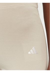 Adidas - adidas Legginsy Essentials Small Logo JD3072 Beżowy Flare Fit. Kolor: beżowy. Materiał: bawełna #5