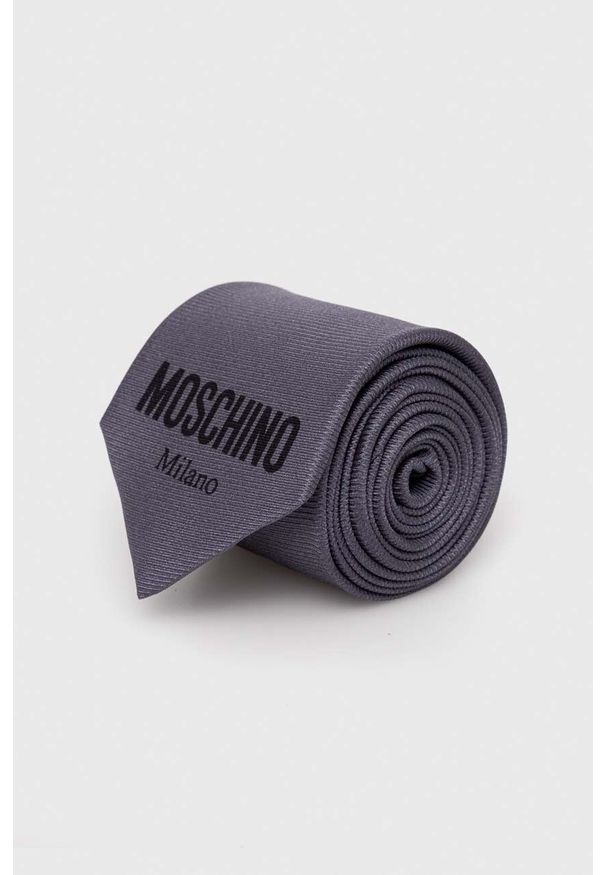 MOSCHINO - Moschino krawat kolor szary. Kolor: szary. Materiał: materiał. Wzór: gładki
