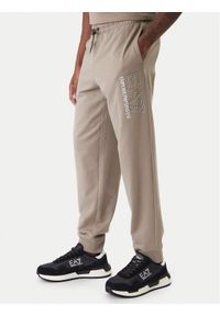 EA7 Emporio Armani Spodnie dresowe 7M001316 AF13512 U6167 Beżowy Regular Fit. Kolor: beżowy. Materiał: bawełna #1