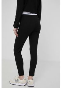 Calvin Klein Jeans legginsy damskie kolor czarny gładkie. Kolor: czarny. Materiał: włókno, dzianina, materiał, wiskoza. Wzór: gładki #3