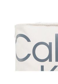 Calvin Klein Jeans Saszetka Sport Essentials Flatpack18 Aop K50K509825 Beżowy. Kolor: beżowy. Materiał: materiał #4