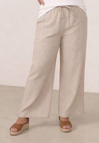 Born2be - Beżowe Spodnie Casual Szerokie ze Sznurkiem i Gumką w Pasie Caeena. Okazja: na co dzień. Kolekcja: plus size. Kolor: beżowy. Długość: długie. Styl: casual #1