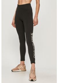 Calvin Klein Jeans - Legginsy. Kolor: czarny. Materiał: dzianina. Wzór: nadruk #1