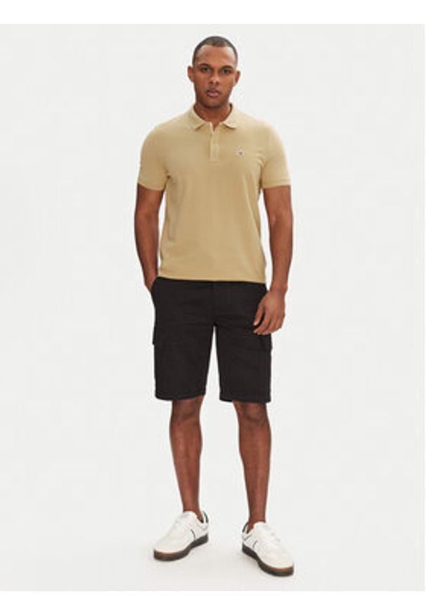 Tommy Jeans Polo DM0DM20676 Beżowy Slim Fit. Typ kołnierza: polo. Kolor: beżowy. Materiał: bawełna