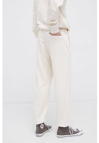 Reebok Classic Spodnie męskie gładkie. Kolor: beżowy. Materiał: bawełna. Wzór: gładki #3