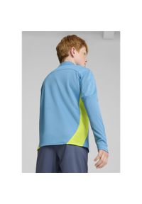 Puma - Młodzieżowa bluza treningowa Manchester City F.C. z zamkiem 1/4 PUMA. Kolor: żółty, wielokolorowy, niebieski