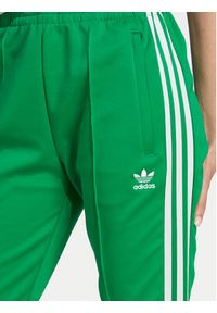 Adidas - adidas Spodnie dresowe adicolor SST IK6601 Zielony Slim Fit. Kolor: zielony. Materiał: syntetyk #5