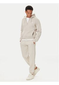 Guess Spodnie dresowe Z5BB18 KB3P2 Beżowy Regular Fit. Kolor: beżowy. Materiał: bawełna