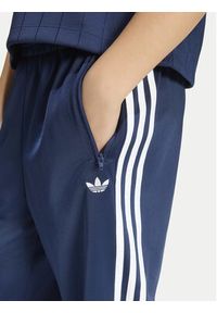 Adidas - adidas Spodnie dresowe Firebird HZ6650 Granatowy Regular Fit. Kolor: niebieski. Materiał: syntetyk #8