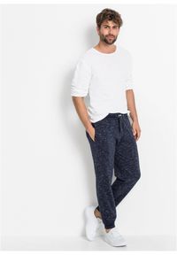 bonprix - Melanżowe spodnie sportowe ze ściągaczem. Kolor: niebieski. Wzór: melanż, prążki. Styl: sportowy #2