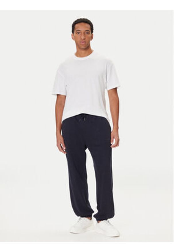TOMMY HILFIGER - Tommy Hilfiger Spodnie dresowe UM0UM03627 Niebieski Regular Fit. Kolor: niebieski. Materiał: bawełna