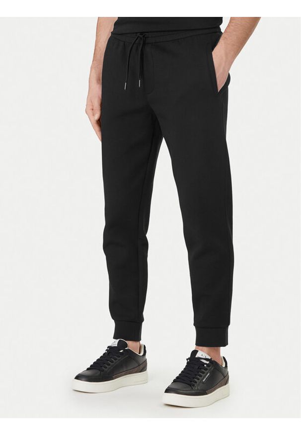 Armani Exchange Spodnie dresowe XM000373 AF10818 UC001 Czarny Regular Fit. Kolor: czarny. Materiał: bawełna