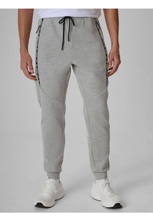 4f - 4F Spodnie kibica joggery męskie - szare XL. Kolor: szary. Materiał: materiał, dresówka, bawełna, dzianina. Wzór: gładki