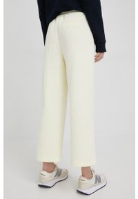 Calvin Klein spodnie dresowe damskie kolor żółty gładkie. Kolor: żółty. Materiał: dresówka. Wzór: gładki #2