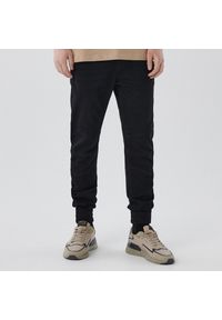 Cropp - Czarne jeansowe joggery - Czarny. Kolor: czarny