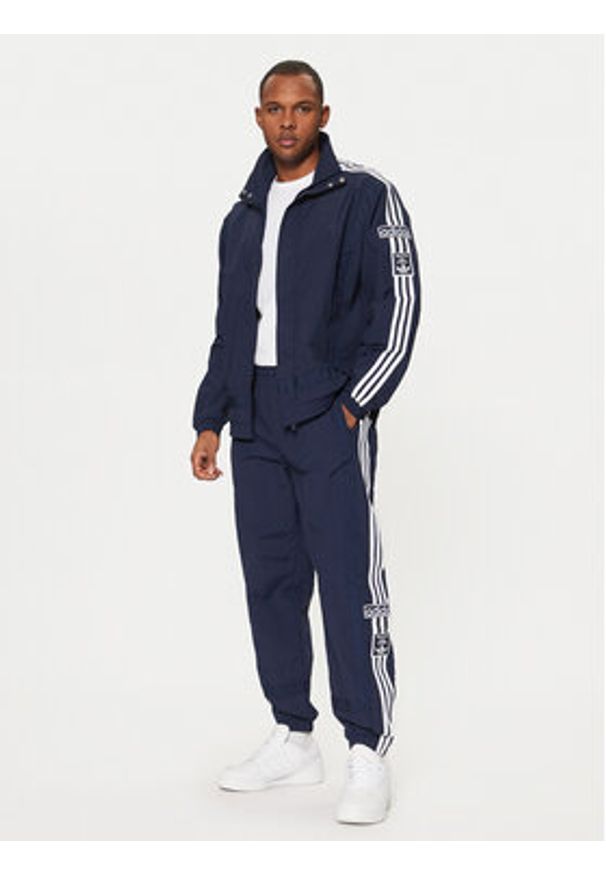 Adidas - adidas Spodnie dresowe Adibreak JD4258 Granatowy Loose Fit. Kolor: niebieski. Materiał: syntetyk