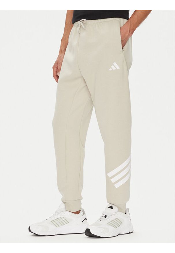 Adidas - adidas Spodnie dresowe Future Icons 3-Stripes JW7092 Beżowy Regular Fit. Kolor: beżowy. Materiał: bawełna