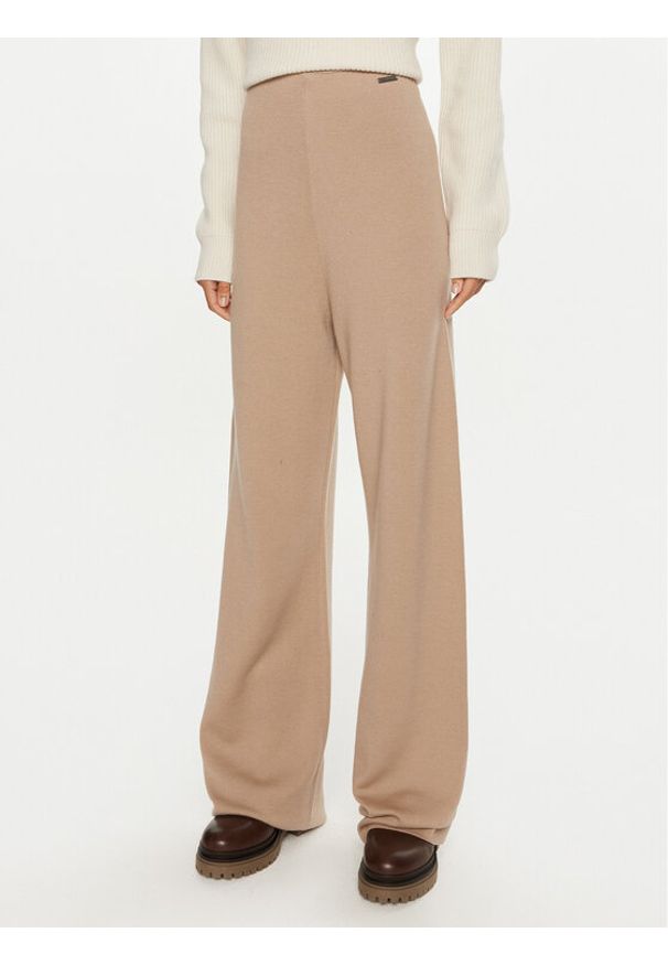 Calvin Klein Spodnie dresowe K20K207680 Beżowy Relaxed Fit. Kolor: beżowy. Materiał: wełna