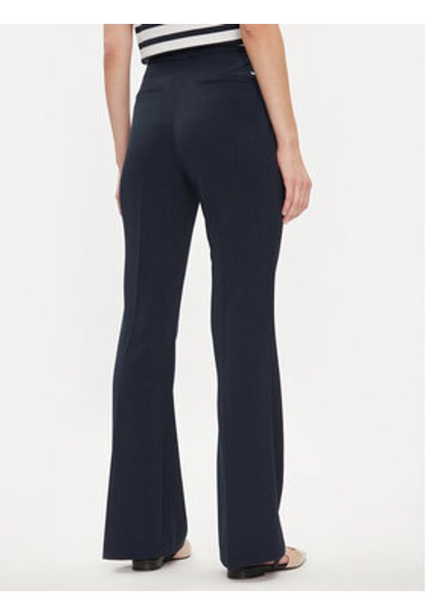 TOMMY HILFIGER - Tommy Hilfiger Spodnie materiałowe Gold Button WW0WW42455 Granatowy Flare Fit. Kolor: niebieski. Materiał: syntetyk