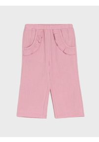 Sinsay - Muślinowe spodnie z ozdobną falbanką - różowy. Kolor: różowy #1