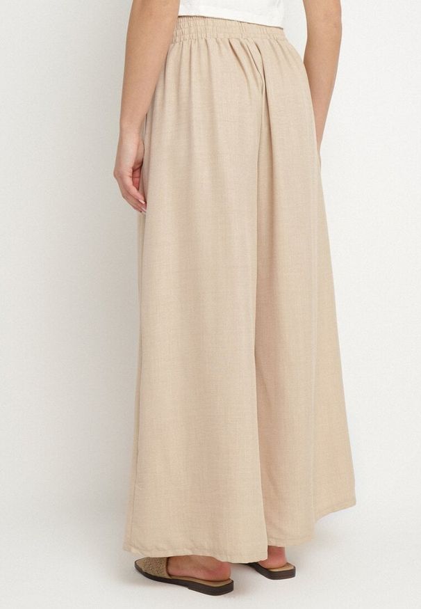 Born2be - Beżowe Spodnie o Szerokim Kroju z Wysokim Stanem i Wiązaniem Telarieta. Okazja: na co dzień. Stan: podwyższony. Kolor: beżowy. Materiał: len. Styl: klasyczny, casual, elegancki