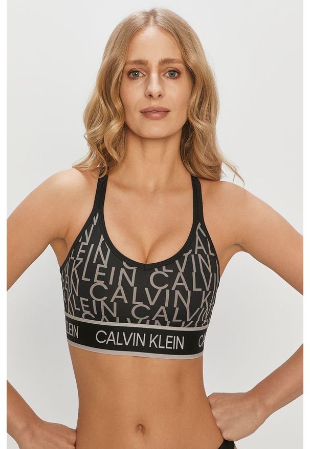 Calvin Klein Performance - Biustonosz sportowy. Kolor: czarny. Materiał: poliester, materiał, elastan