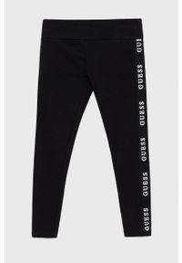 Guess legginsy dziecięce kolor czarny z nadrukiem. Kolor: czarny. Wzór: nadruk #1