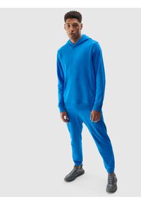 4f - Spodnie dresowe joggery z bawełną organiczną męskie - niebieskie. Kolor: niebieski. Materiał: bawełna, dresówka
