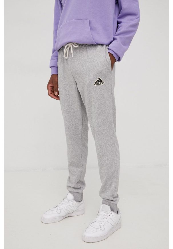 Adidas - adidas spodnie dresowe HE1857 męskie kolor szary z aplikacją. Kolor: szary. Materiał: dresówka. Wzór: aplikacja