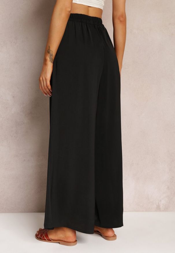 Renee - Czarne Spodnie z Szerokimi Nogawkami i Gumką w Pasie Jacobisa. Stan: podwyższony. Kolor: czarny