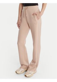Guess Spodnie dresowe V3RB21 K7UW2 Beżowy Regular Fit. Kolor: beżowy. Materiał: syntetyk #1